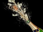 champagne bottle exploding with money